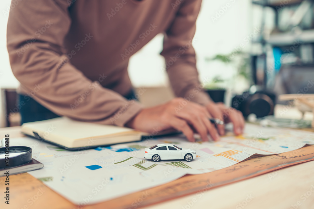 model car on road map and tourist planning before traveling in vocation, holidays or long weeked. Travel , Adventure and Discovery concept. model car on road map and tourist planning before traveling in vocation, holidays or long weeked. Travel , Adventure and Discovery concept.