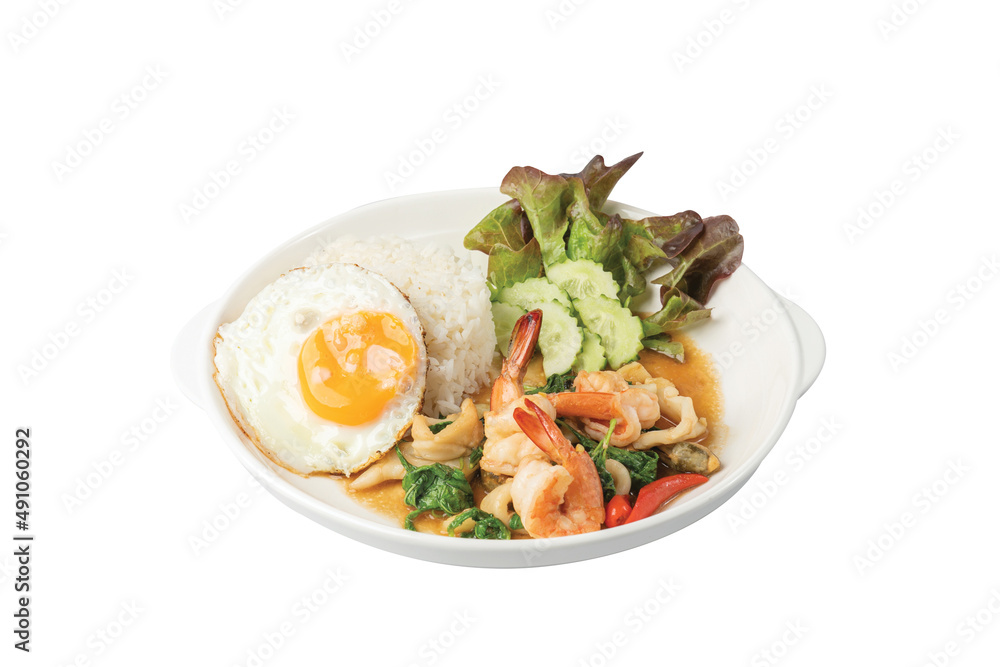Spicy fried seafood basil fried egg and Jasmine Rice in white plate Spicy fried seafood basil fried egg and Jasmine Rice in white plate