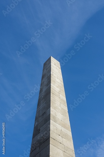 Photograph of the Monument to Victims. In background with beautiful blue sky and tiny clouds. Beautiful sunny weather.