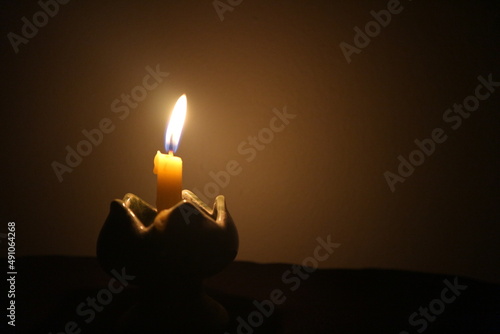 burning candle in the dark