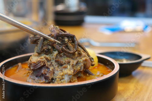 Pork back-bone stew with a lot of bracken is provided in the pot.