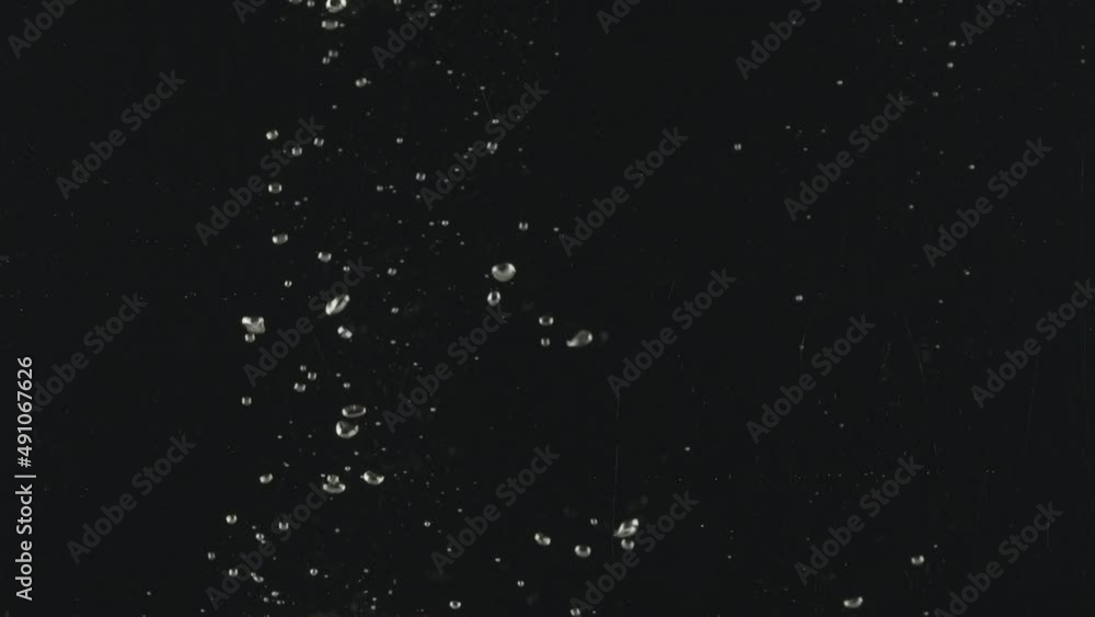 Slow-motion of Red Small Cherry Tomatoes falling into the Water. Fresh Vegetables Splashing into Clear Water on Black Background. Vegetables Float in the Water. Healthy Eating. Slow-motion of Red Small Cherry Tomatoes falling into the Water. Fresh Vegetables Splashing into Clear Water on Black Background. Vegetables Float in the Water. Healthy Eating.