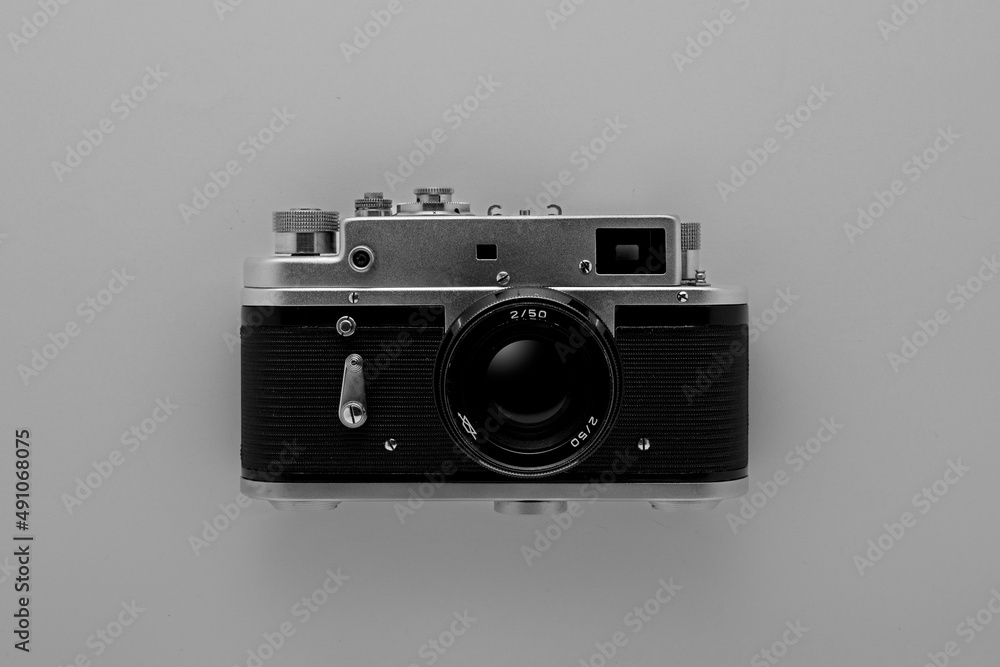 Old photo camera on black background. Wallpaper Old photo camera on black background. Wallpaper