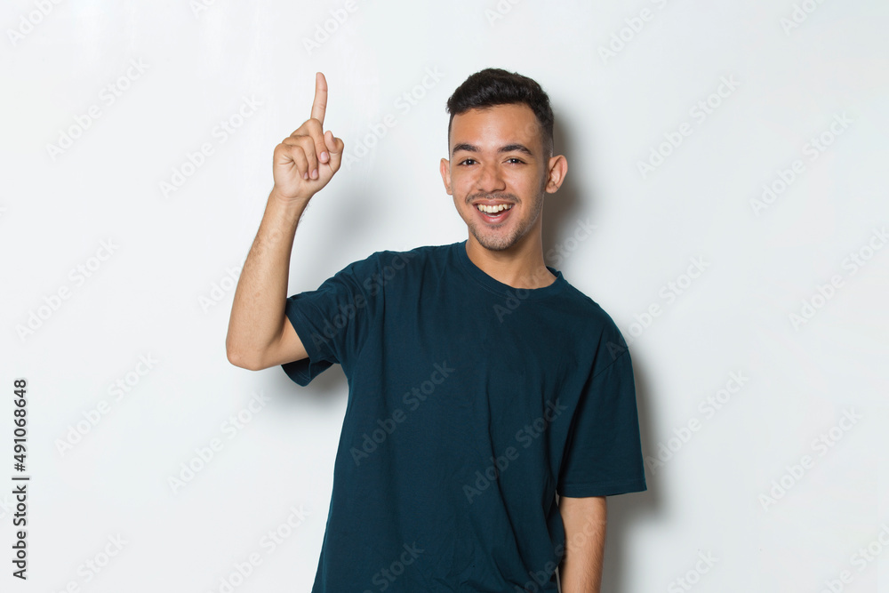 young handsome man pointing finger on empty space isolated on white background
young handsome man pointing finger on empty space isolated on white background