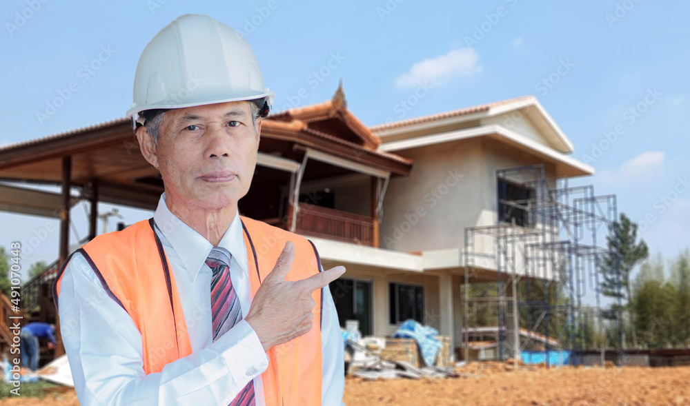 A middle-aged civil engineer working on a construction site, an Asian elder. A middle-aged civil engineer working on a construction site, an Asian elder.