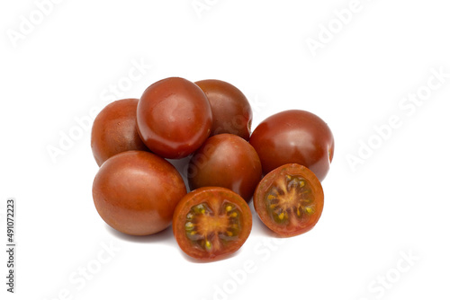 A batch of cherry tomatoes, the mini kumato variety. Isolated on white background. photo