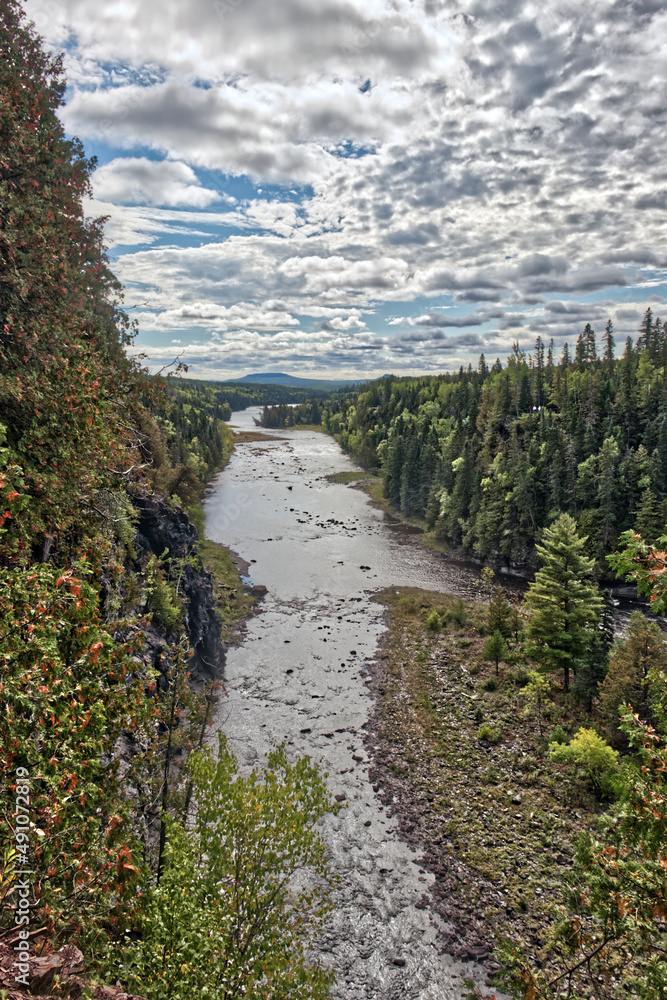 And quiet flows the river from the thunderous falls - Kakabeka Falls, Thunder Bay, ON, Canada And quiet flows the river from the thunderous falls - Kakabeka Falls, Thunder Bay, ON, Canada
