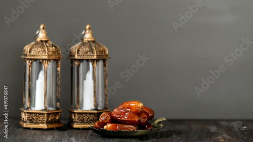 Lantern and Dates on Wooden Table. Ramadan kareem holiday celebration concept