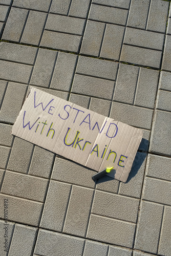 poster with the inscription we stand Ukraine War Ukraine and Russia. The flag of Ukraine and the symbol of victory. Freedom and text Pray for Ukraine.Military conflict in Ukraine and dove peace flag