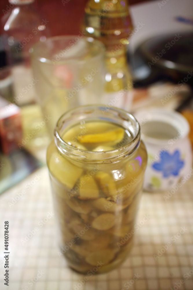 jar of pickled mushrooms on the table jar of pickled mushrooms on the table