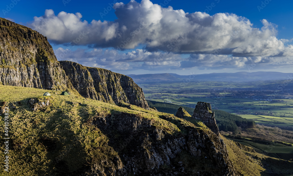 Fototapeta premium Hiking and Wild Camping, Binevenagh Mountain, Causeway coast and glens, area of oustanding natural beauty, County Londonderry, Northern Ireland