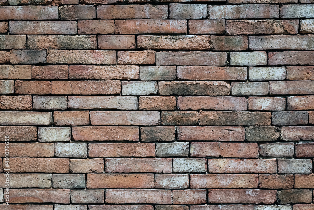 Brown brick wall. Texture of brown brick wall pattern background. Abstract wallpaper texture with old and vintage style pattern. Home or office design backdrop. Outstandingly beautiful architecture. Brown brick wall. Texture of brown brick wall pattern background. Abstract wallpaper texture with old and vintage style pattern. Home or office design backdrop. Outstandingly beautiful architecture.
