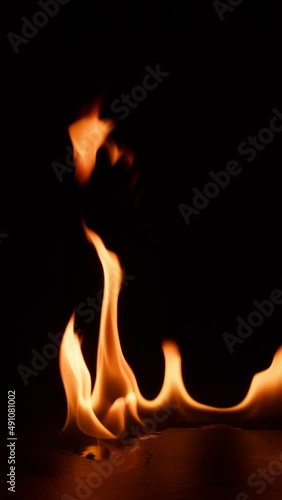 fire bruning on black slate stone. Hot Elements for compositing vertical photo