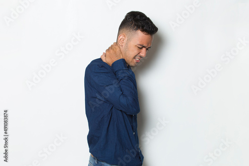young handsome business man with sore throat neck and shoulder pain, isolated on a white background  © dwi