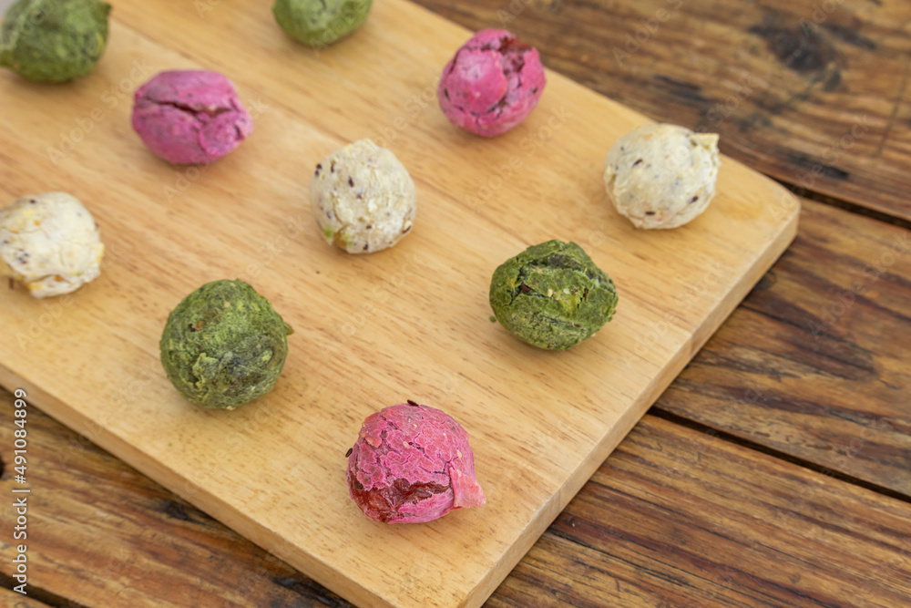 Brazilian vegan cheese bread - Multicolored gluten free rolls made of tapioca flour, potato, spinach and beetroot. Brazilian vegan cheese bread - Multicolored gluten free rolls made of tapioca flour, potato, spinach and beetroot.