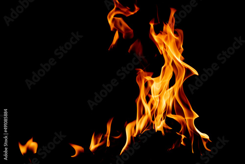 Fire flame texture. Burning material backdrop. Burn effect pattern. Blaze and torch wallpaper. Heat and haze backdrop.