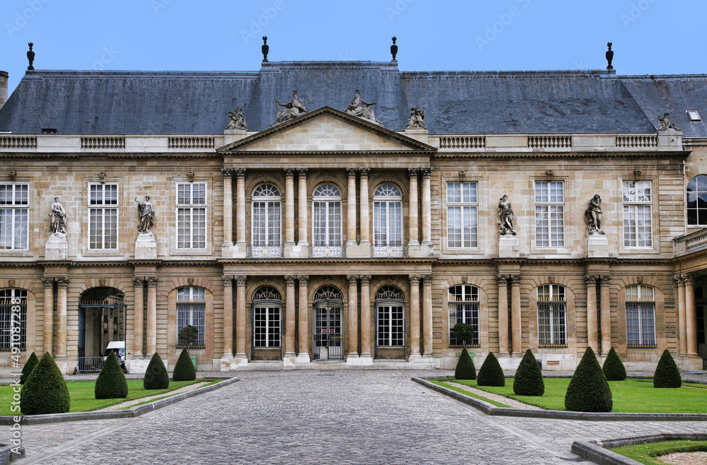 Paris, France:  The ornate baroque facade of the French National Archives museum in the Marais district, housed in the 18th century Soubise palace