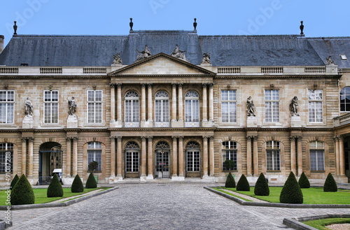 Paris, France: The ornate baroque facade of the French National Archives museum in the Marais district, housed in the 18th century Soubise palace