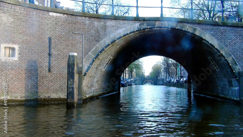 Herengracht canal with bridges in a row and houses over the Amstel River. Amsterdam, Netherlands
