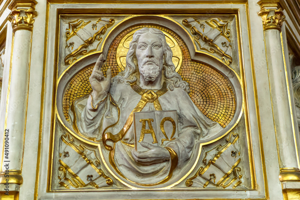 Traditional bas relief decoration with gold coating used frequently inside catholic churches.