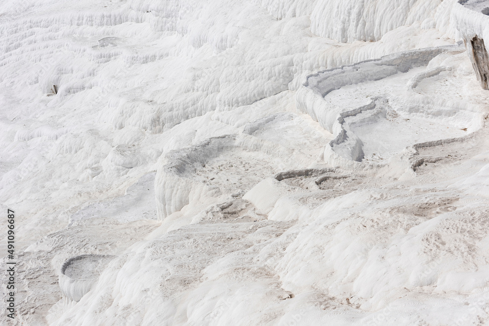 White dried-up travertine terraces without water. Pamukkale, Turkey.