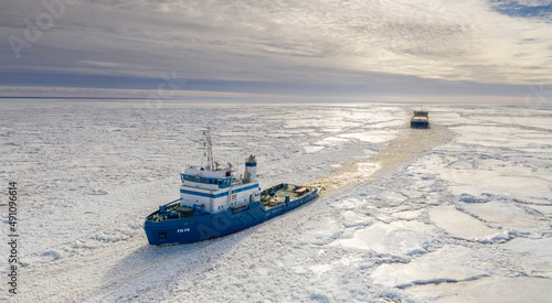 aerial, assisting, baltic, bay, beach, blue, boat, cargo ship, clouds, coast, cracked, cruise, drone, estonia, ferry, float, frozen, guarding, harbor, harsh environment, holiday, ice, icebreaker, land