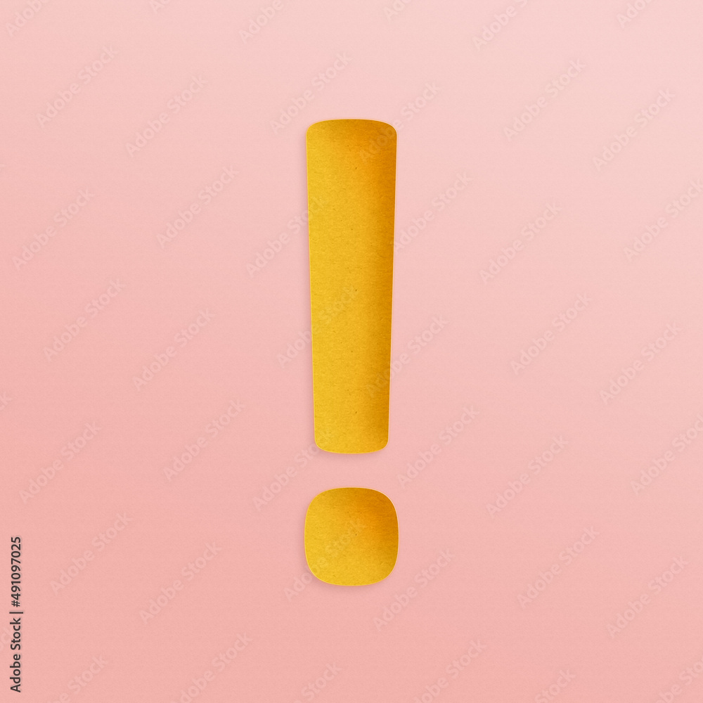 A golden yellow exclamation mark on a blush pink background in a paper cutout style A golden yellow exclamation mark on a blush pink background in a paper cutout style