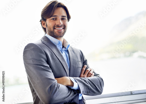 Hes young and successful. Portrait of a handsome young businessman. photo