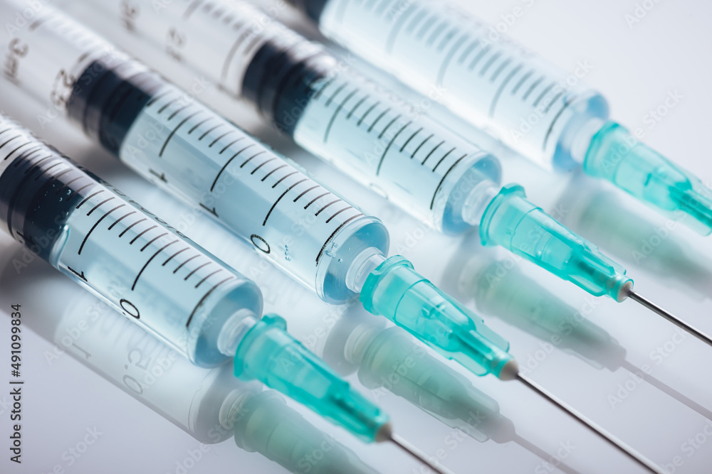 Medicine. A bunch of different syringes over a white background Medicine. A bunch of different syringes over a white background