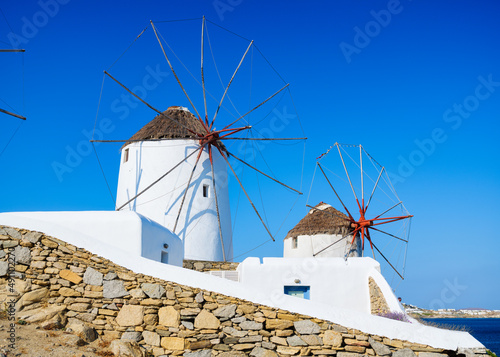 Mykonos, Greece. Traditional windmills. The symbol of Mykonos at the day time. Photo for travel and vacation.