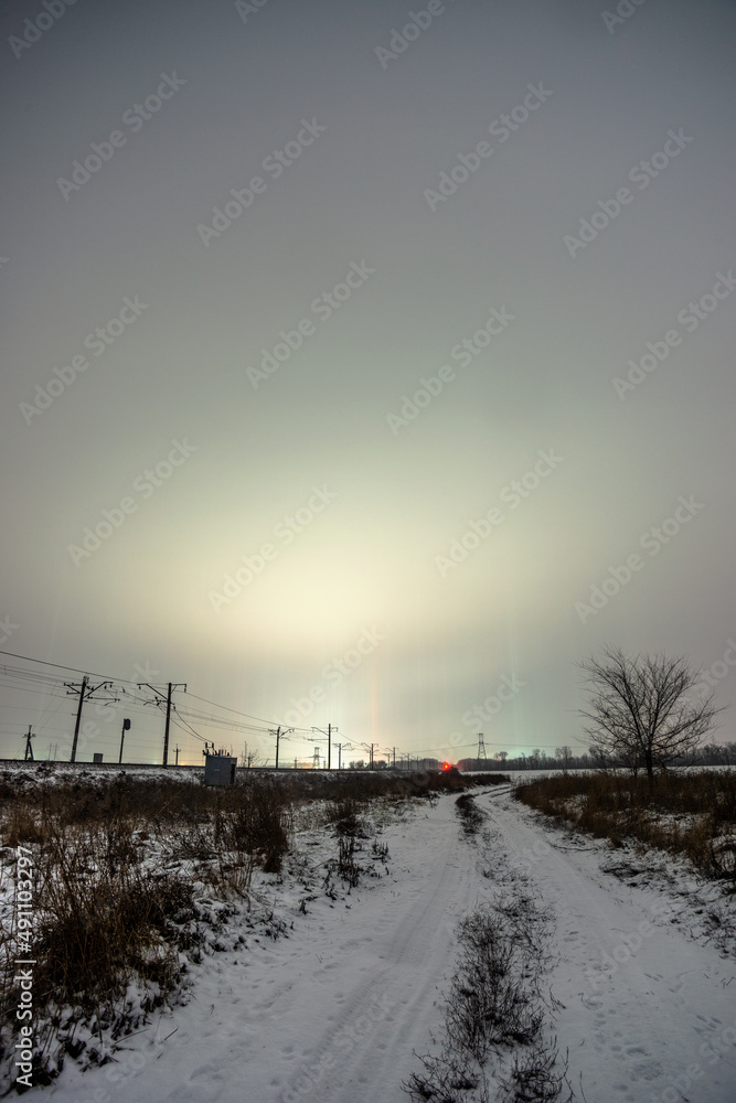Obraz premium road to city forest in the night . Night landscape. Nightsky and clouds . Stars in the sky . Lights of the city . 