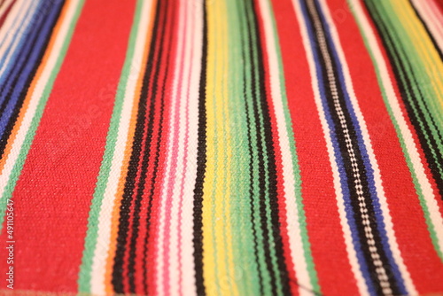 Mexican pattern. Colorful bright striped fabric.