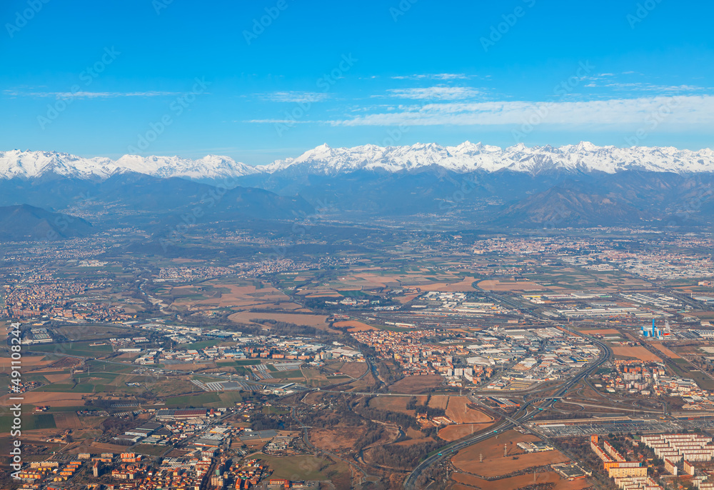 Piedmont suburbia of Turin . Scenery of Alps and city in Italy 