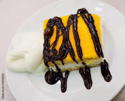 Image of almond sponge cake with vanilla and chocolate light mousse photo