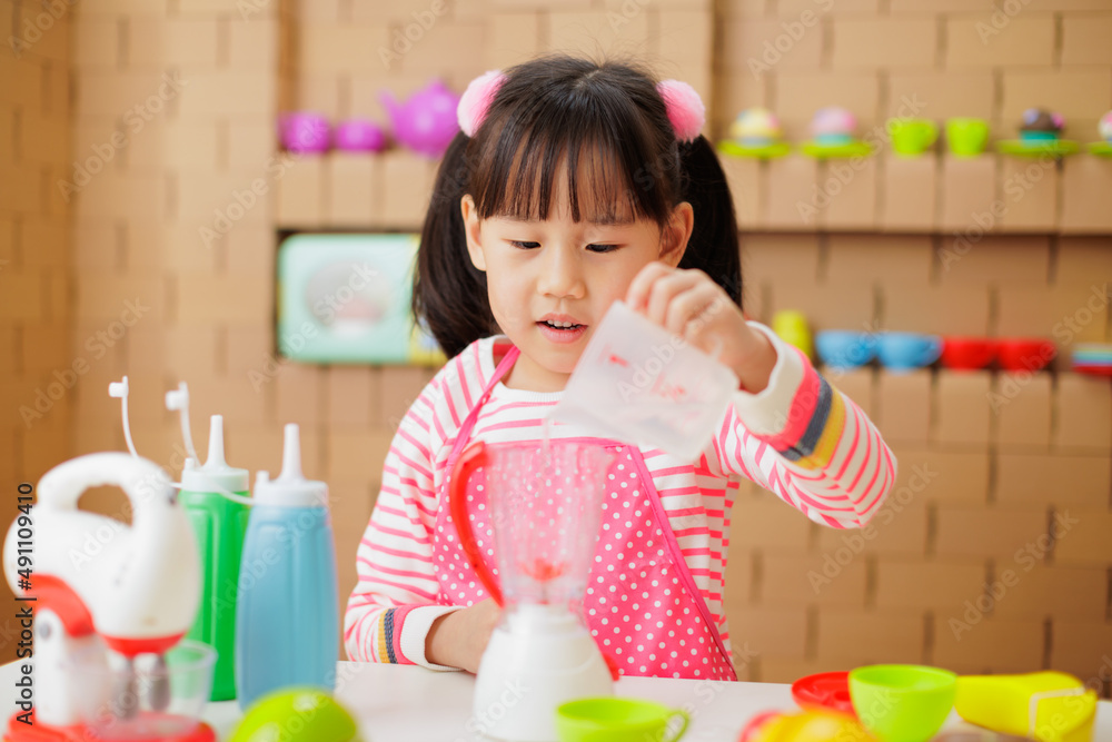 young girl pretend playing food preparing at home young girl pretend playing food preparing at home