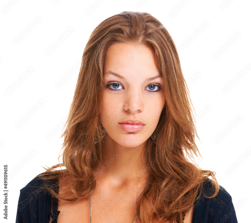 Young, proud and opinionated. Isolated portrait of a serious young woman staring at the camera, isolated on white. Young, proud and opinionated. Isolated portrait of a serious young woman staring at the camera, isolated on white.