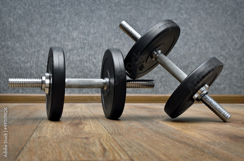 Sports equipment, dumbbells on the gym floor