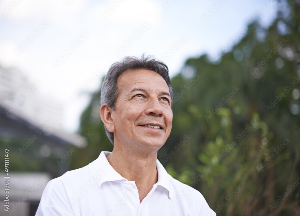 Getting some fresh air. Cropped shot of a handsome mature man standing outdoors. Getting some fresh air. Cropped shot of a handsome mature man standing outdoors.