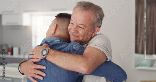 I missed you so much son. Shot of a father and son hugging.