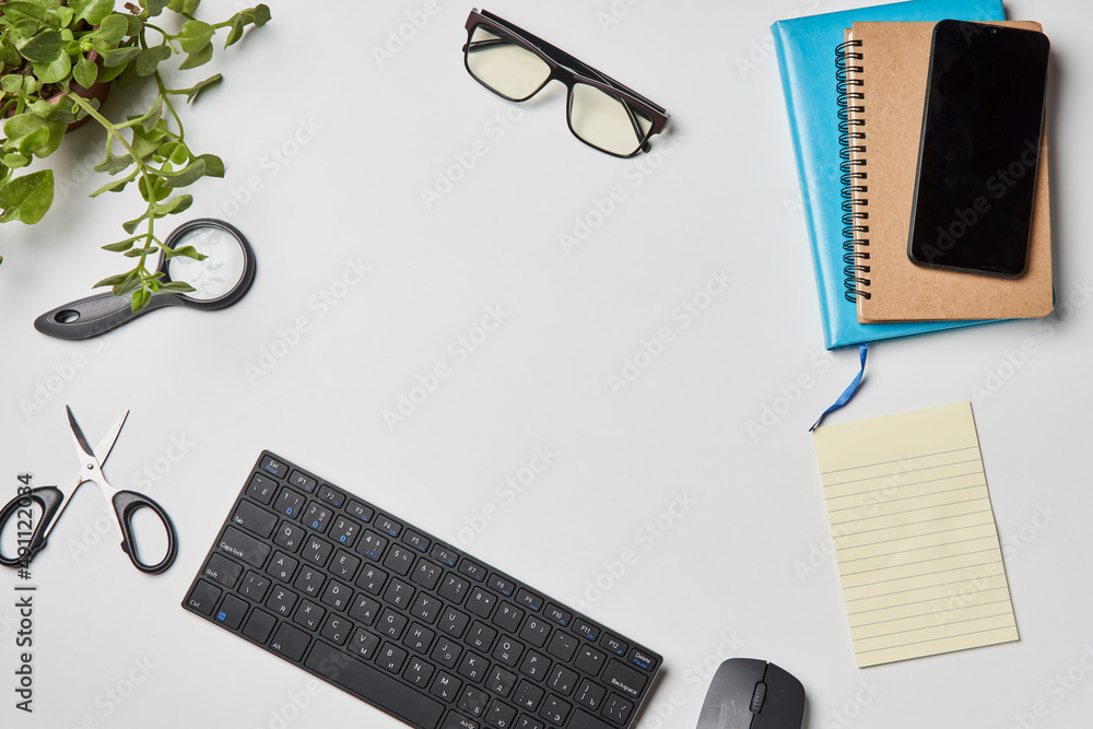 Bright office workspace. Work space with notepad, keyboard, coffee and glasses. Work space table desk. Flat lay, top view, copy space Bright office workspace. Work space with notepad, keyboard, coffee and glasses. Work space table desk. Flat lay, top view, copy space