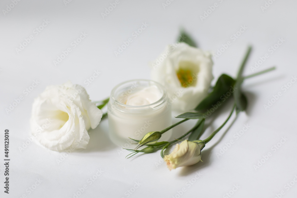 Cream in a jar on a white background Cream in a jar on a white background