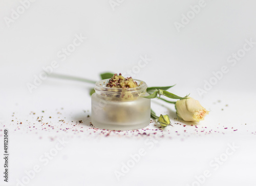 Cream in a jar on a white background