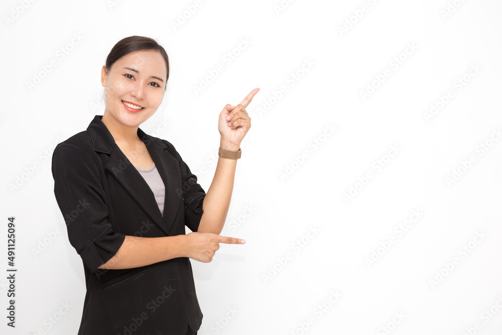 Beautiful Asian business woman wearing black suit presenting something on white background and copy space. Confident Asian working woman smiling and cheerful Beautiful Asian business woman wearing black suit presenting something on white background and copy space. Confident Asian working woman smiling and cheerful