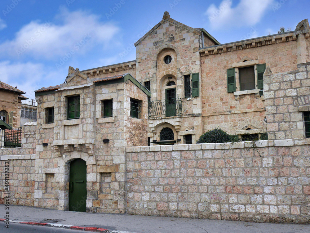 Fototapeta premium Old stone building with courtyard behind wall, Jerusalem