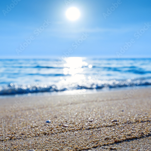 close up sand beach with clear blue sea and sky