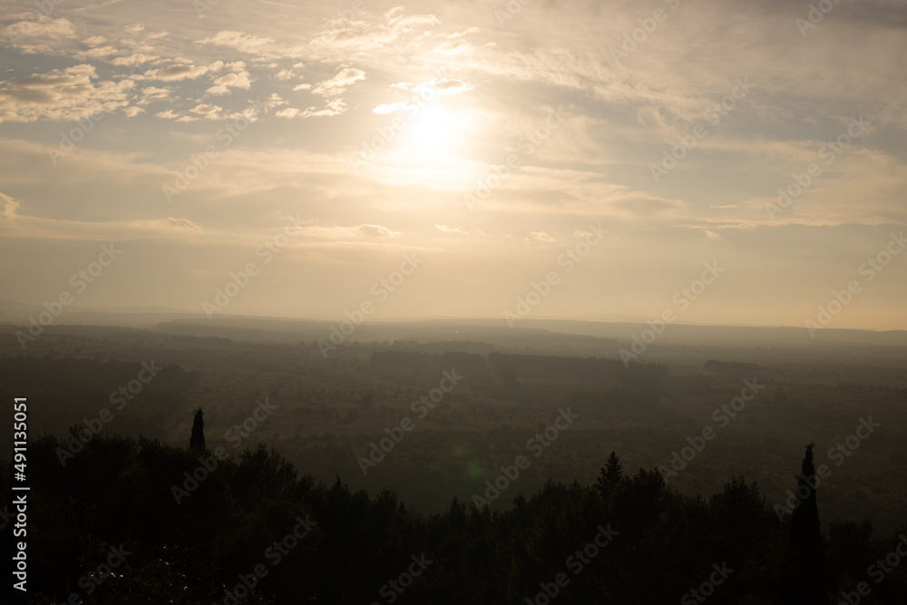 Wide angle view over the beautiful Italian landscape at sunset from Castel del monte - travel photography Wide angle view over the beautiful Italian landscape at sunset from Castel del monte - travel photography