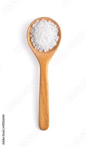 Salt in woodn spoon isolated on white background © supamas