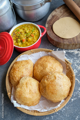 Delicious and healthy homemade Indian meal. Puri aka Poori with Aloo Masala. An Indian vegetarian breakfast or snack meal eaten with spicy potato masala.