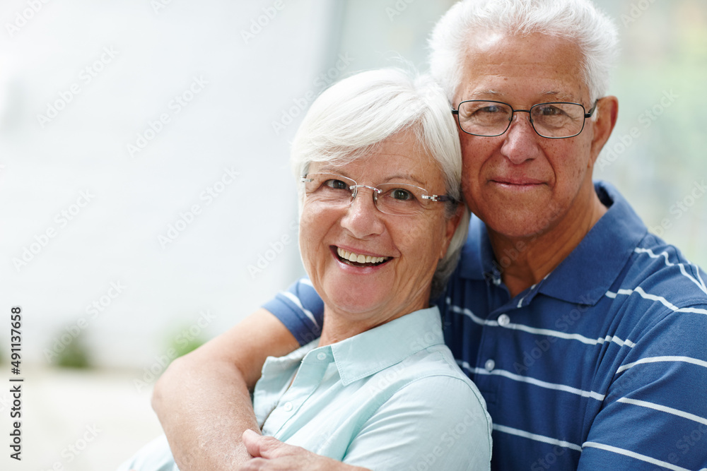 Husband and wife together for life. Shot of a happy senior couple smiling at the camera.