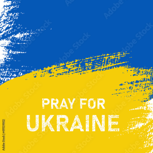 Ukraine flag design. Pray Ukraine banner sign. Paint brush with colors of Ukraine flag. The message for war in Ukraine.